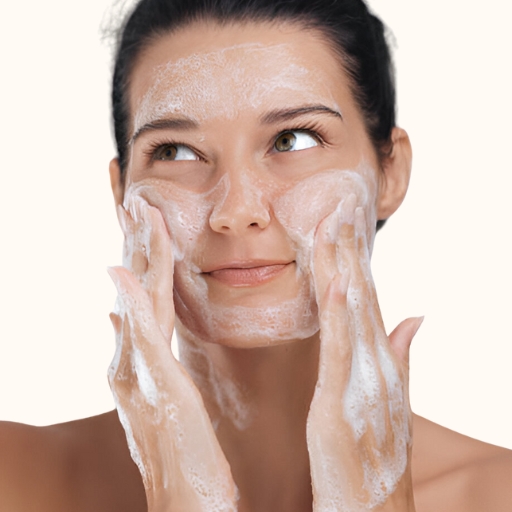 woman cleansing face with donkey milk face wash